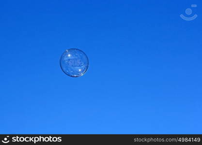 Soap bubble flying against the blue sky. Soap bubble flying against the blue sky.