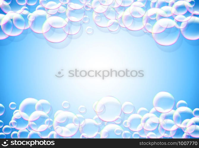 Soap bubbles blue background with rainbow colored airy foam