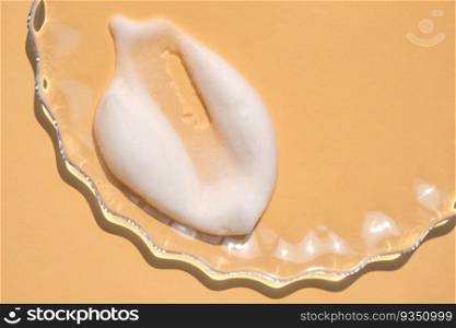 Soap foam on a beige background. A wonderful display of the texture of a cosmetic product.. Soap foam on a light beige background.