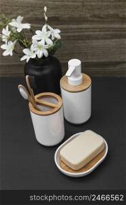 soap toothbrush cosmetic bottle white flower vase tabletop