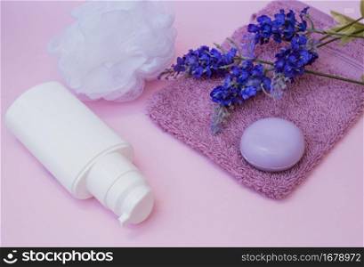 soap towel lavender flower loofah cosmetic bottle pink backdrop