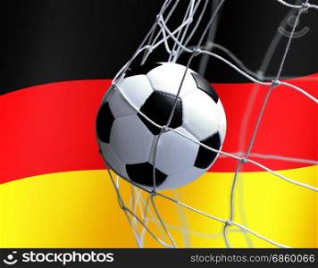 soccer ball flies into the net gate on German flag background