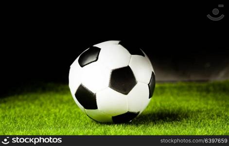 Soccer ball on a green grass close-up. Concept - football passion. Soccer ball on the grass before the game