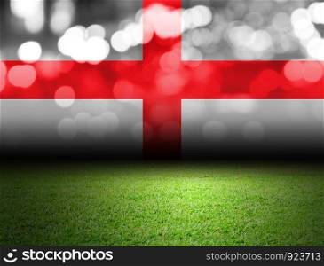 Soccer field and bokeh with england flag