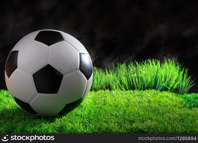 soccer football sport equipment on green grass field use for sport background and related topic. soccer football sport equipment on green grass field