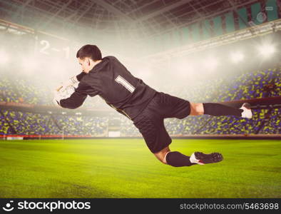 soccer or football goalkeeper is catching ball on stadium, warm colors toned