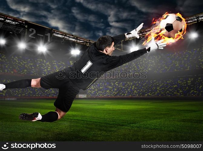 Soccer or football keeper catching ball. Soccer or football goalkeeper catching ball on stadium