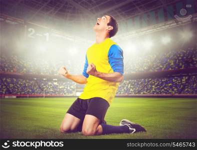 soccer or football player is celebrating goal on stadium, warm colors toned