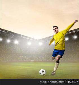 soccer or football player is kicking ball on stadium. soccer or football player