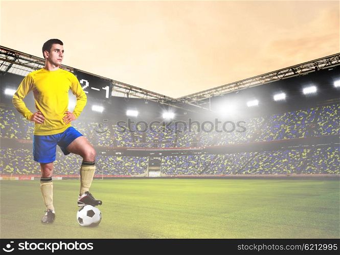 soccer or football player on stadium. soccer or football player is standing on stadium