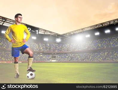 soccer or football player on stadium. soccer or football player is standing on stadium