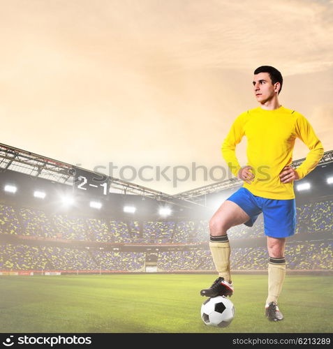 soccer or football player on stadium. soccer or football player is standing on stadium