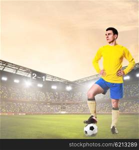 soccer or football player on stadium. soccer or football player is standing on stadium