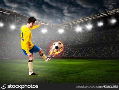soccer or football player. soccer or football player is kicking ball on stadium