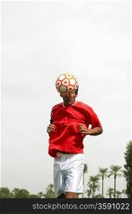 Soccer Player Heading a Ball