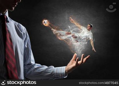 Soccer player kicking ball. Soccer player with ball in action in male palm