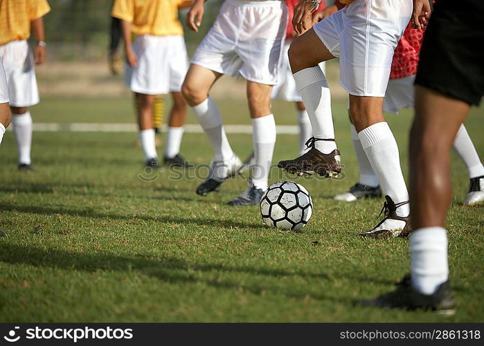 Soccer Players Competing for the Ball