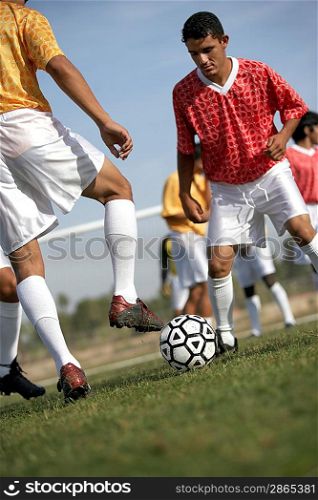 Soccer Players Competing for the Ball