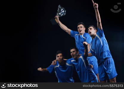 soccer players team group celebrating the victory and become champion of game while holding win coup