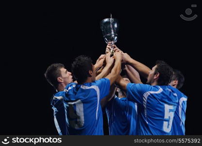 soccer players team group celebrating the victory and become champion of game while holding win coup