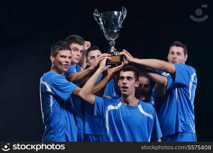 soccer players team group celebrating the victory and become champion of game while holding win coup