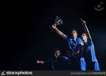 soccer players team group celebrating the victory and become champion of game while holding win coup