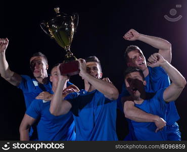 soccer players team group celebrating the victory and become champion of game while holding win coup