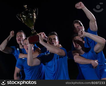 soccer players team group celebrating the victory and become champion of game while holding win coup