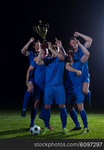 soccer players team group celebrating the victory and become champion of game while holding win coup
