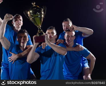 soccer players team group celebrating the victory and become champion of game while holding win coup