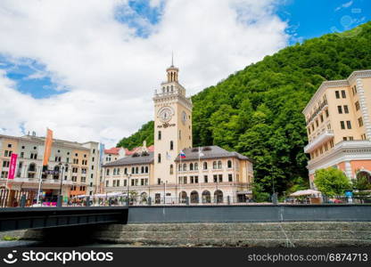 Sochi, Russia - Juny 21, 2017: Rosa Khutor Clock tower and infrastructure of Alpine ski resort