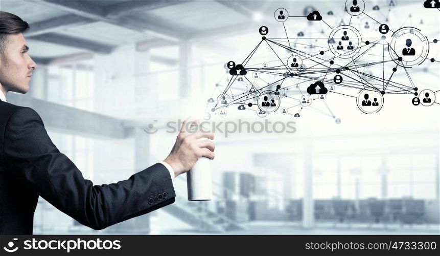 Social connectivity concept mixed media. Concept of connection with businessman in office spraying social net concept from balloon