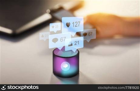 social media, ai and technology concept - smart speaker with virtual music note hologram on table at office over internet icons. smart speaker with social network icons