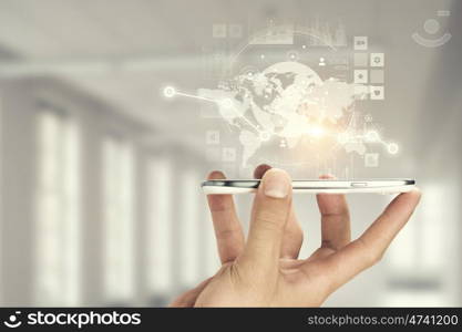 Social media and cloud computing. Smartphone in hand and cloud computing user interface