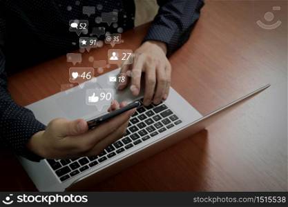 Social media and Marketing virtual icons screen concept.business man hand using smart phone,laptop, online banking payment communication network technology 4.0,internet wireless application development sync app