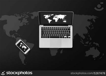 social media and technology concept - laptop computer with world map on screen and smartphone top view. laptop computer with world map and smartphone