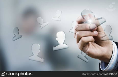 Social net concept. Businessman pressing modern social buttons with marker on screen
