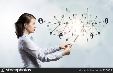 Social network and connection concept. Young beautiful woman using tablet as symbol of modern technology