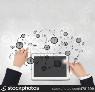 Social networking business. Hands of businessman using tablet representing connection concept