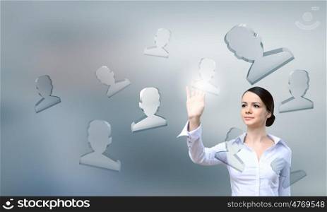 Social networking concept. Businesswoman pressing modern social icons on virtual screen