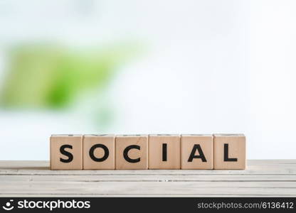 Social sign made of cubes on a wooden table