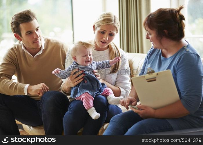 Social Worker Visiting Family With Young Baby
