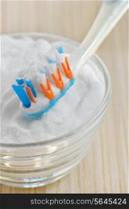 sodium bicarbonate (baking soda) and a toothbrush