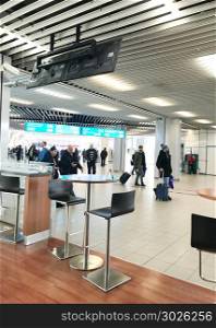 "Sofia, Bulgaria - March 25, 2018: Passengers walking in Sofia Airport Terminal 2. "Sofia Airport" EAD is a licensed airport operator of the largest international airport in Bulgaria."