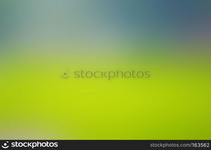 Soft, blurry, photographed bokeh background of greens and yellows from nature.