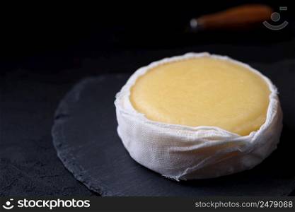 Soft cheese in cheesecloth