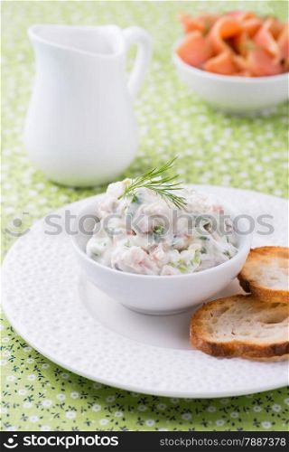Soft cheese spread with salmon and green onions, selective focus