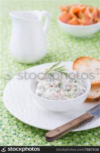 Soft cheese spread with salmon and green onions, selective focus