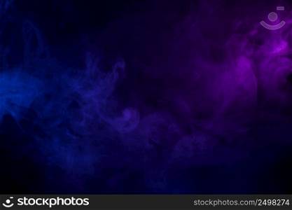 Soft clouds of colorful smoke dark abstract backgound