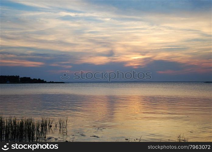 Soft colored water reflections by the coast of the Baltic Sea